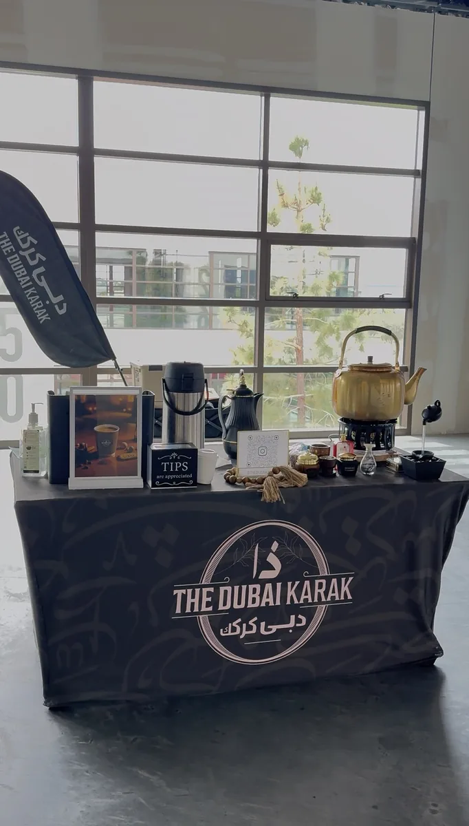 Traditional teapots and brewing equipment on The Dubai Karak service counter